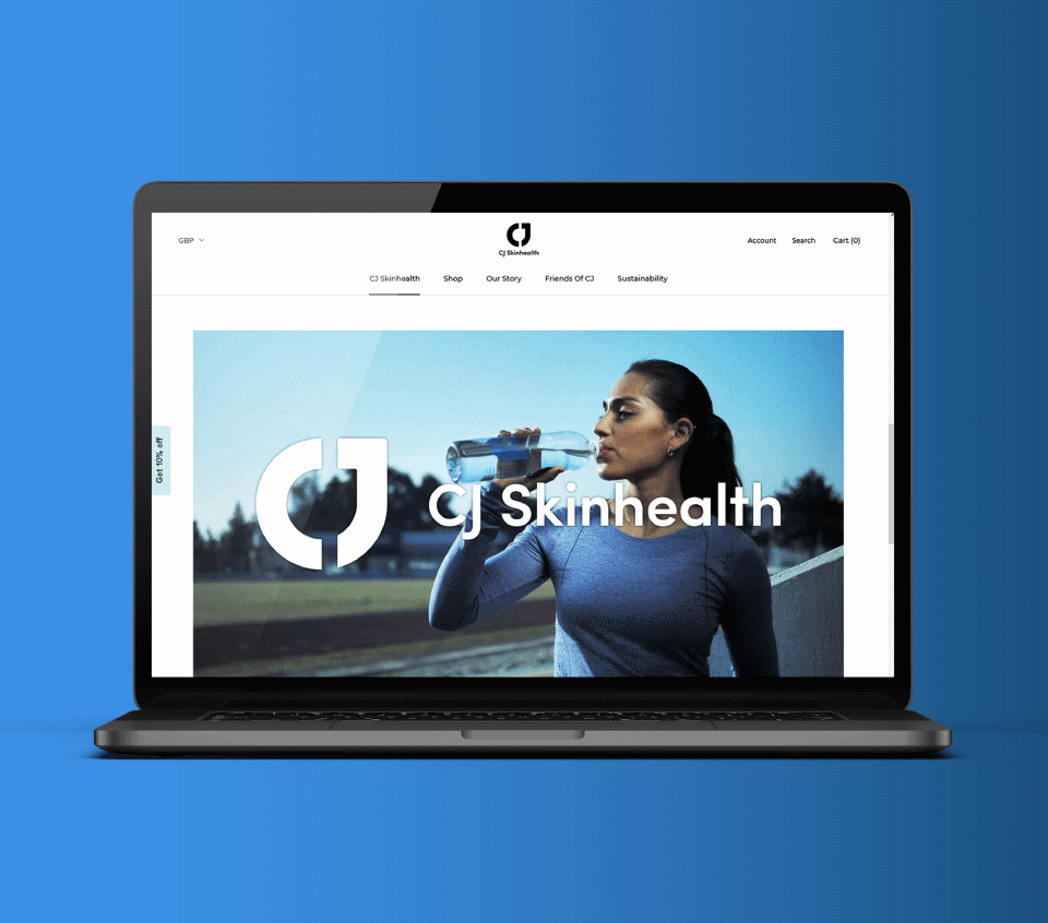a laptop open on the CJ Skinhealth website showing a woman drinking from a bottle