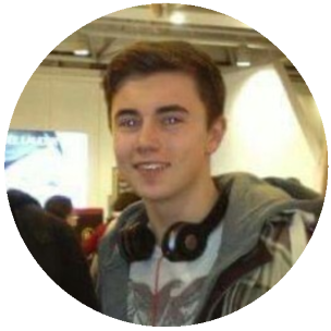 photo of a very young looking Luke wearing headphones